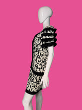 Load image into Gallery viewer, Black and white patterned dress on a mannequin against a plain background