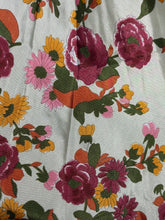 Load image into Gallery viewer, Floral patterned fabric with colorful flowers on a light background
