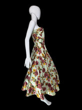 Load image into Gallery viewer, Mannequin wearing a floral dress against a plain wall.