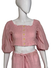 Load image into Gallery viewer, Mannequin wearing a pink smocked top with yellow buttons and matching skirt against a plain background