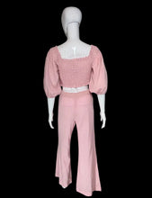 Load image into Gallery viewer, Mannequin wearing a pink outfit with a white top and pants against a plain wall.