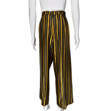 Load image into Gallery viewer, Black and yellow striped pants on mannequins with a neutral background