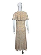 Load image into Gallery viewer, Floral dress on a mannequin against a plain background
