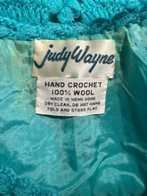 Load image into Gallery viewer, Judy Wayne label on a teal knitted fabric