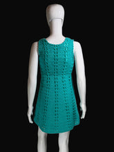 Load image into Gallery viewer, Teal knitted dress on a white mannequin against a plain background.