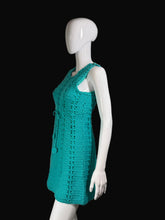 Load image into Gallery viewer, Teal crochet dress on a white mannequin against a plain background.
