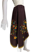 Load image into Gallery viewer, Brown skirt with floral embroidery on a mannequin against a white background.