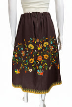 Load image into Gallery viewer, Brown skirt with colorful floral embroidery on a mannequin against a white background.
