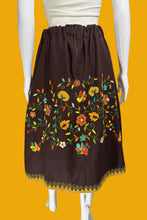 Load image into Gallery viewer, Brown skirt with colorful floral embroidery on a mannequin against a white background.