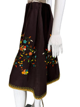 Load image into Gallery viewer, Mannequin wearing a brown garment with colorful floral embroidery on a white background.