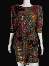 Load image into Gallery viewer, Mannequin wearing a patterned dress with a neutral background.