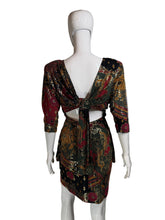 Load image into Gallery viewer, Mannequin wearing a patterned dress with a plain background.