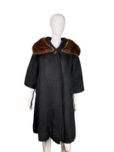 Load image into Gallery viewer, Black coat with brown fur collar on a mannequin against a neutral background