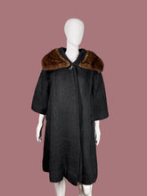 Load image into Gallery viewer, Black coat with brown fur collar on a mannequin against a neutral background