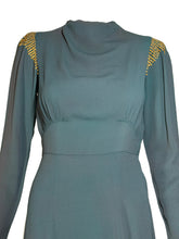Load image into Gallery viewer, Teal dress with gold embellishments on a white background