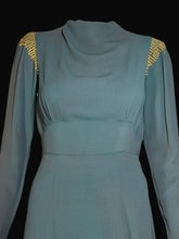 Load image into Gallery viewer, Teal dress with gold embellishments on a white background