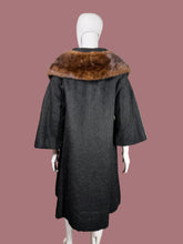 Load image into Gallery viewer, Black coat with brown fur collar on a mannequin against a neutral background