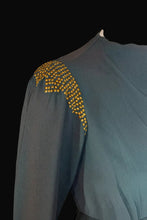Load image into Gallery viewer, Teal fabric with gold embellishments on a white background