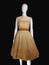 Load image into Gallery viewer, Mannequin wearing a beige gown on a white background.