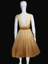 Load image into Gallery viewer, Mannequin wearing a beige dress against a plain wall.