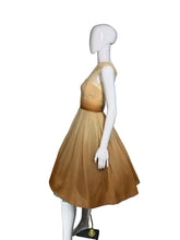 Load image into Gallery viewer, Mannequin wearing a gold dress against a plain wall.