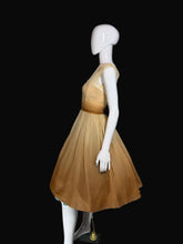 Load image into Gallery viewer, Mannequin wearing a gold dress against a plain wall.