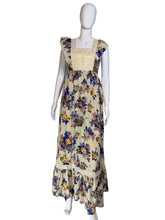 Load image into Gallery viewer, Floral dress on a mannequin against a plain wall.