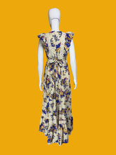 Load image into Gallery viewer, Floral dress on a mannequin against a white wall.