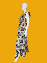 Load image into Gallery viewer, Floral dress on a mannequin against a plain wall.