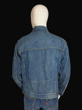 Load image into Gallery viewer, Blue denim jacket on a mannequin against a plain background.