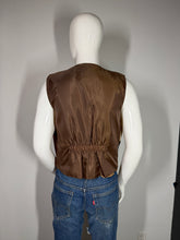 Load image into Gallery viewer, Mannequin wearing a brown garment and blue jeans on a plain background
