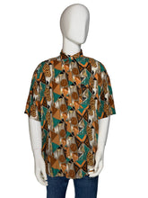 Load image into Gallery viewer, Mannequin wearing a patterned shirt with a brown and teal geometric design