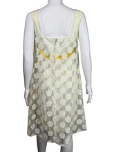 Load image into Gallery viewer, Mannequin wearing a floral dress with yellow accents on a white background