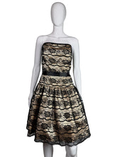 Load image into Gallery viewer, Mannequin wearing a strapless lace dress with a black belt on a white background