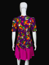 Load image into Gallery viewer, Colorful dress with geometric floral pattern on a mannequin against a plain background