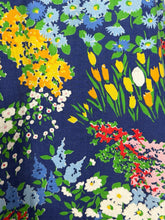 Load image into Gallery viewer, Colorful floral pattern on a blue background
