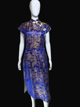 Load image into Gallery viewer, Mannequin wearing a blue dress with gold patterns on a white background