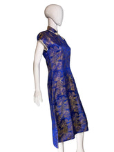 Load image into Gallery viewer, Mannequin wearing a blue and gold patterned garment against a white background