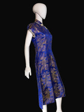 Load image into Gallery viewer, Mannequin wearing a blue and gold patterned garment against a white background