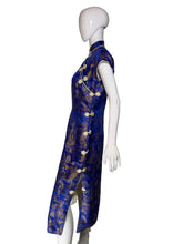 Load image into Gallery viewer, Mannequin wearing a blue dress with gold patterns on a white background