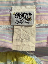 Load image into Gallery viewer, Close-up of a label with "Oops California" text on a fabric background