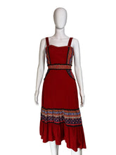 Load image into Gallery viewer, Red dress with patterned layers on a white mannequin against a plain background