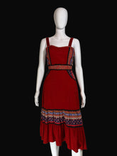 Load image into Gallery viewer, Red dress with patterned layers on a white mannequin against a plain background