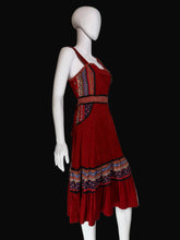 Load image into Gallery viewer, Red dress with patterned layers on a white mannequin against a plain background