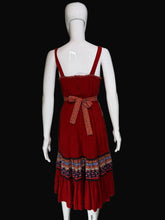 Load image into Gallery viewer, Red dress with patterned layers on a white mannequin against a plain background