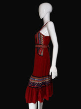 Load image into Gallery viewer, Red dress with patterned layers on a white mannequin against a plain background