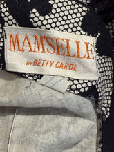 Load image into Gallery viewer, Fabric with a Manselle by Betty Carol label on a textured background