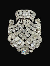 Load image into Gallery viewer, Decorative brooch with intricate design and sparkling stones on a black background