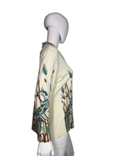 Load image into Gallery viewer, Mannequin wearing a patterned shirt with long sleeves on a plain background