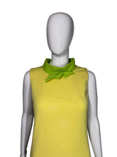 Load image into Gallery viewer, Mannequin wearing a yellow garment with green trim on a white background